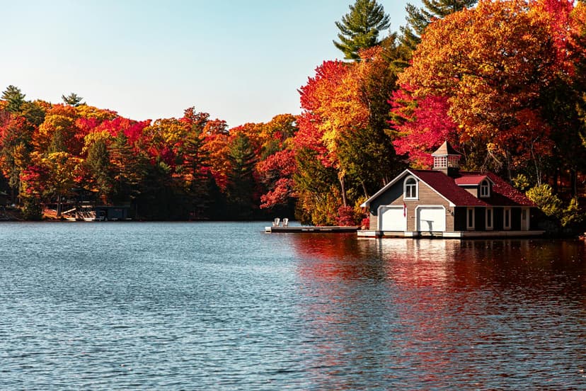 Lakeside cottage in Ontario with vibrant fall foliage